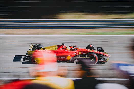 A thrilling shot of a Ferrari on the race track during the Italian Grand Prix.