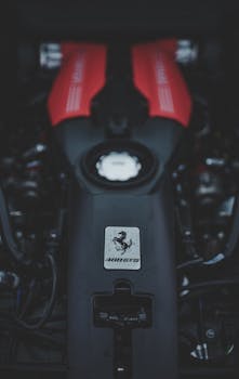 Focused view of a red Ferrari engine showcasing automotive engineering and power.