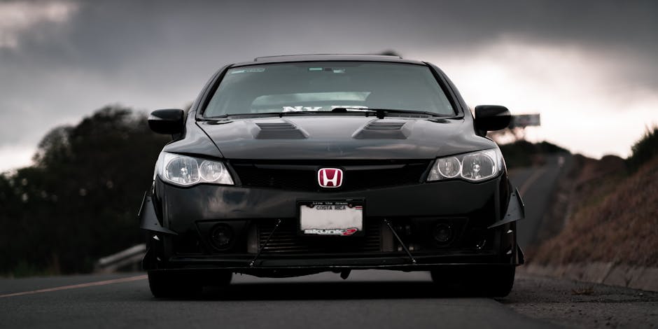 2001 Honda Civic EP3 Type R, showcasing its sleek 3-door hatchback design and performance features like the K20A engine, 6-speed manual transmission, and sporty red Recaro seats.