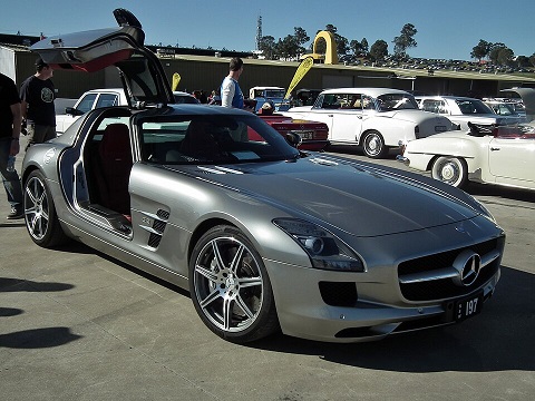Parked Mercedes SLS with opened doors