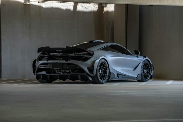 A McLaren 720S parked in an indoor garage, showcasing its sleek design and luxury appeal.