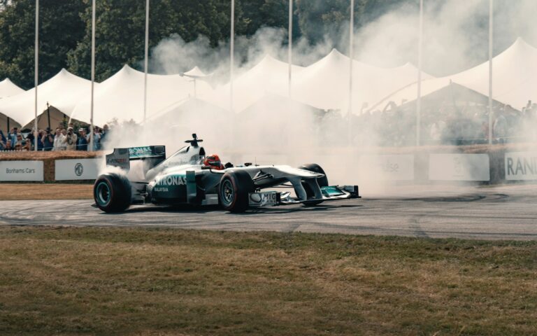 A man driving a race car on top of a race track