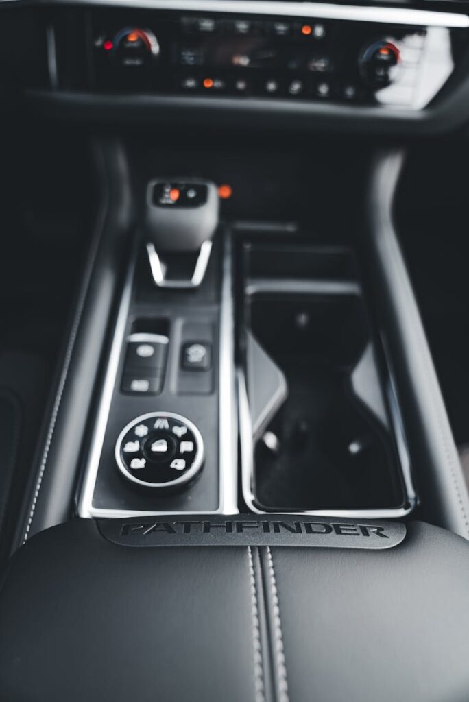 Close-up of Nissan Pathfinder's sleek center console showcasing its modern control layout.