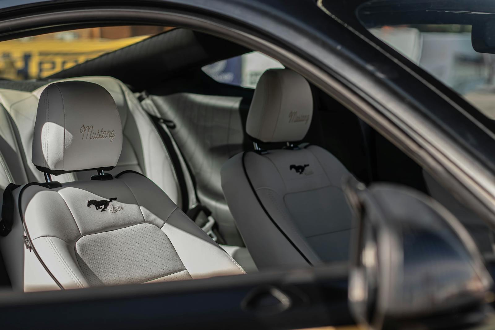 Explore the sleek and comfortable interior of a Ford Mustang, showcasing premium leather seats.