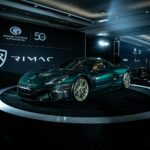 A Rimac electric sports car on display at an automotive event, showcasing sleek design and innovation.