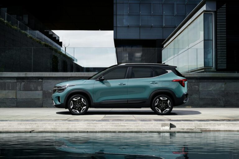 green and black car near modern building