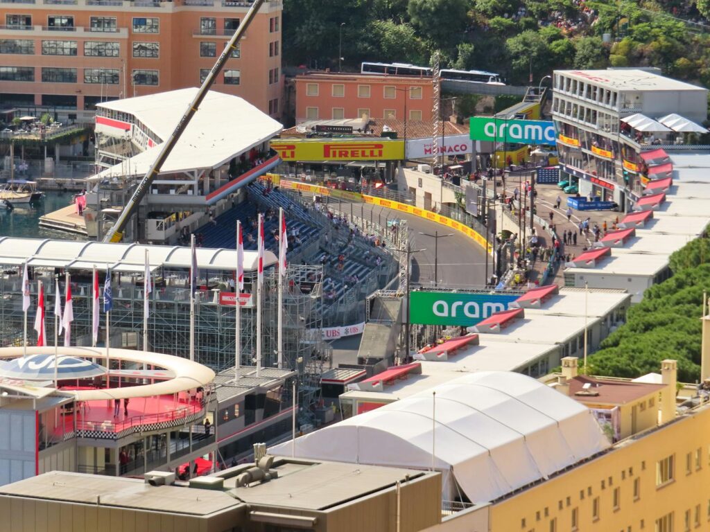 Aerial view of Monaco Grand Prix circuit with spectators and iconic track details.