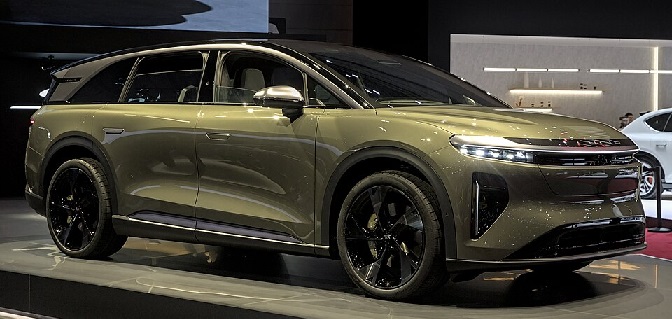 Lucid Gravity side view at auto show display, showcasing sleek exterior design