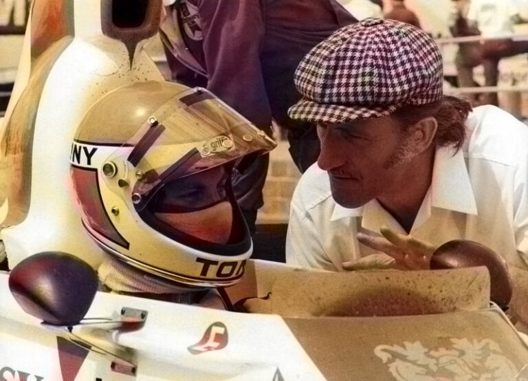 Graham Hill talking to Tony Brise in the Hill GH1 during practice at the 1975 British Grand Prix.